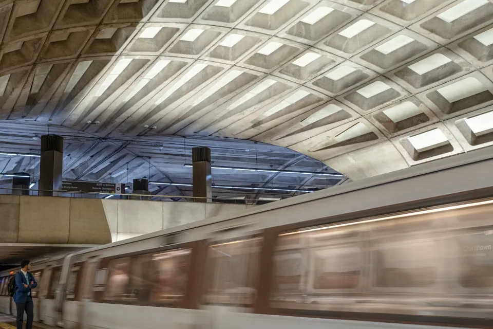 Blurred image of train passing by platform at Washington, D.C. undergroundtrain station